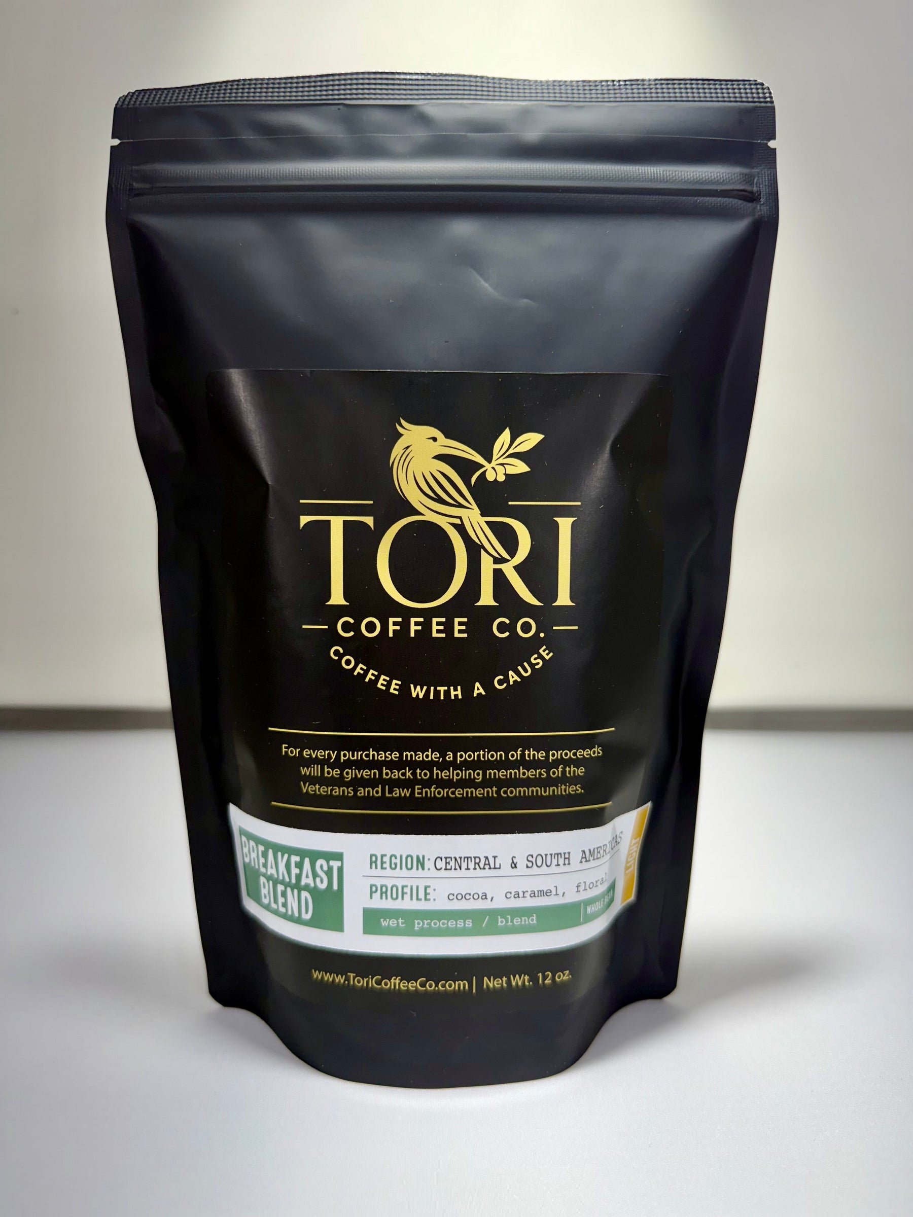 Black coffee bag with 'Tori Coffee Co.' branding on a white background
