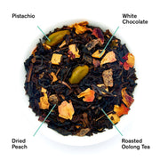 Tea blend with labeled ingredients including pistachio, white chocolate, dried peach, and roasted oolong tea.