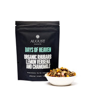 Black tea package labeled 'August' with a bowl of tea leaves on a white background
