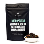 Black tea packaging with visible brand name and tea description on a white background