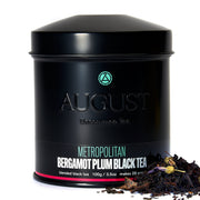 Black tea canister with 'August' branding on a white background