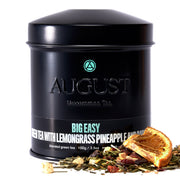 Black tea canister with 'August' branding and tea leaves on a white background