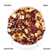 Tea blend with labeled ingredients including pumpkin, apple, vanilla pod, and caramel on a white background.