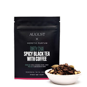 Black tea packaging with a bowl of tea leaves on a white background