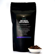 Black coffee package with a small bowl of coffee beans on a white background