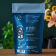 Blue tea packaging with brewing directions on a wooden surface
