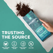 Mushroom coffee package with hand holding it, set against a teal background with text and icons.