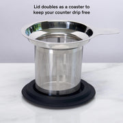 Stainless steel mesh strainer with lid on a white background