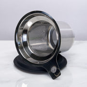 Stainless steel mesh tea strainer on a white background