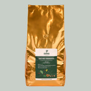 Gold coffee bag with a label on a gray background