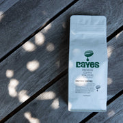 Coffee bag with 'Dayes' branding on a wooden surface