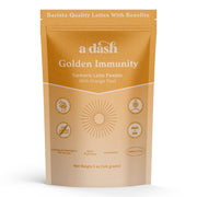 Package of 'a dash Golden Immunity' turmeric latte powder on a white background