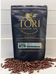 Tori Coffee Co. bag with coffee beans on a white surface