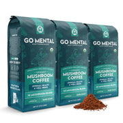 Three packages of Go Mental Mushroom Coffee on a white background