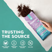 Mushroom coffee package with hand holding it, text 'Trusting the Source' and certification icons on a teal background.