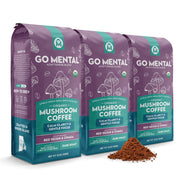 Three packages of Go Mental Organic Mushroom Coffee on a white background