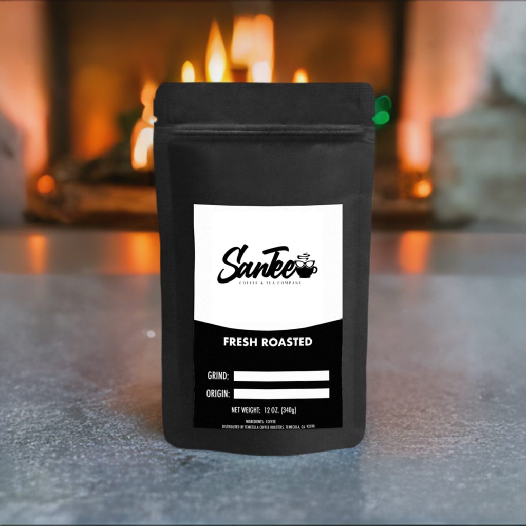 Black coffee packaging with 'Santee' branding on a surface with a fireplace in the background