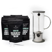 August tea bags and a French press on a white background