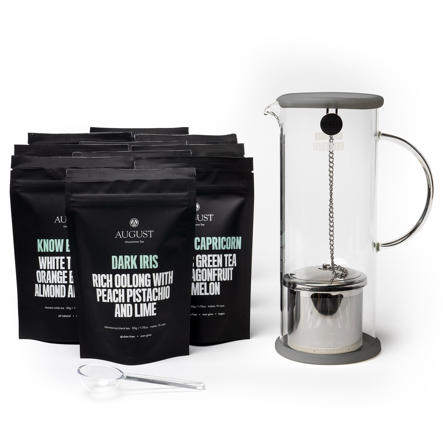 August tea bags and a French press on a white background