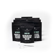 Black tea bags with visible branding on a white background