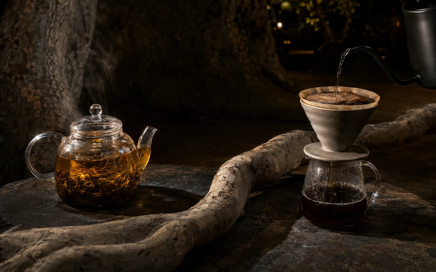 Tea and coffee sharing one stone table beneath a plane tree